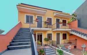 a house with stairs in front of it at Adriana casa vacanze mare Etna Sicilia in Acireale