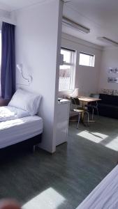 Katil atau katil-katil dalam bilik di Eidavellir Apartments and Rooms