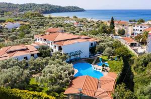 an aerial view of a house with a swimming pool at Makedonia in Potos