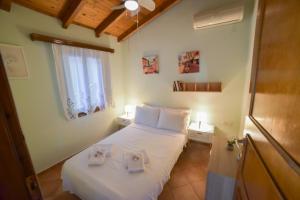 Postel nebo postele na pokoji v ubytování Villa Eva Halkidiki