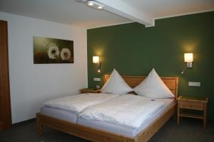Ein Bett oder Betten in einem Zimmer der Unterkunft Landhaus Gnacke
