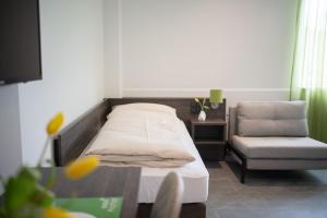 Voodi või voodid majutusasutuse eee Hotel Liezen toas