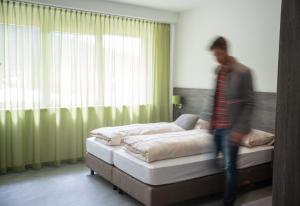 Voodi või voodid majutusasutuse eee Hotel Liezen toas