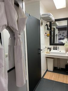 a bathroom with a shower and a sink at B&B Habitat in Beverwijk +52 photos