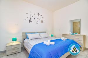 A bed or beds in a room at Appartamenti di Catia a due passi dal mare