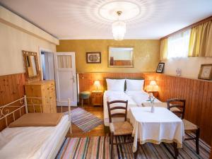 Ένα ή περισσότερα κρεβάτια σε δωμάτιο στο Gästehaus Pension Ria