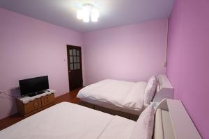 Letto o letti in una camera di Dons Young Homestay