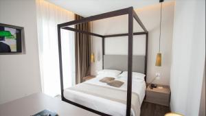 Postel nebo postele na pokoji v ubytování Hotel Principe Palace