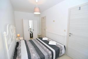 Postel nebo postele na pokoji v ubytování Apartments Knezgrad