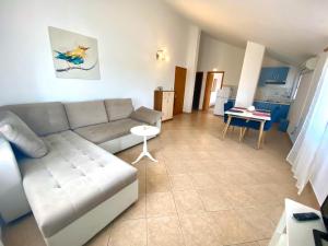 a living room with a couch and a table at Anka in Nerezine