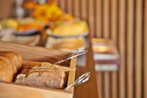 a table with two loaves of bread on it at Sao Rafael Holidays in Albufeira