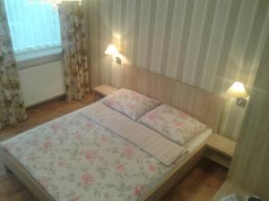 Postel nebo postele na pokoji v ubytování Manifik Pokoje Gościnne