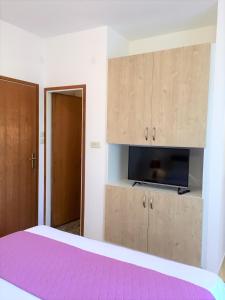 Postel nebo postele na pokoji v ubytování Zlatko Apartments