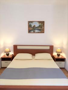 Postel nebo postele na pokoji v ubytování Zlatko Apartments