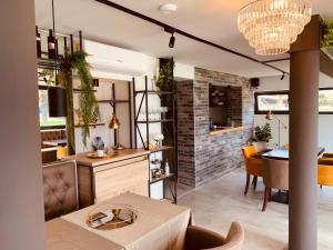 a kitchen and living room with a dining room at Beach Hotel Božikovina in Podstrana