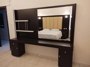 Postel nebo postele na pokoji v ubytování Zain Tabuk Apartment