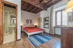 Postel nebo postele na pokoji v ubytování Colosseo Modern Apartment