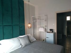 Postel nebo postele na pokoji v ubytování DIIO Suites