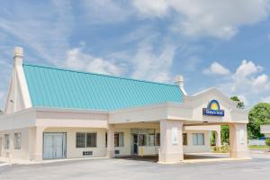 a gas station with a blue roof at Days Inn by Wyndham Chester in Chester