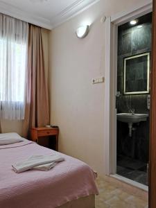 Postel nebo postele na pokoji v ubytování Star Hotel