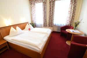 Postel nebo postele na pokoji v ubytování Hotel Payerbacherhof