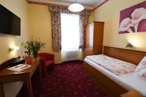 Postel nebo postele na pokoji v ubytování Hotel Payerbacherhof