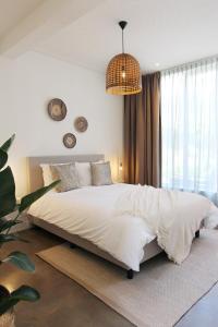Een bed of bedden in een kamer bij Hotel Paradis