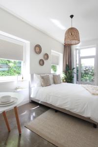 Uma cama ou camas num quarto em Hotel Paradis Zandvoort