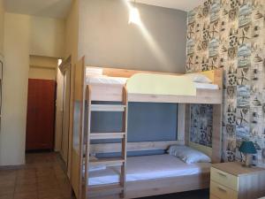 A bed or beds in a room at PLAZA Studios