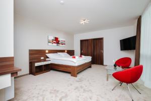 Televízia a/alebo spoločenská miestnosť v ubytovaní Pierre Hotel
