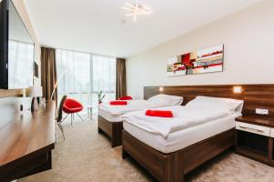 Posteľ alebo postele v izbe v ubytovaní Pierre Hotel