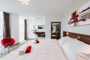 Posteľ alebo postele v izbe v ubytovaní Pierre Hotel