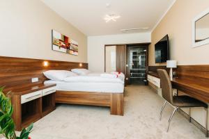 Posteľ alebo postele v izbe v ubytovaní Pierre Hotel