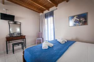 A bed or beds in a room at Hotel Electra