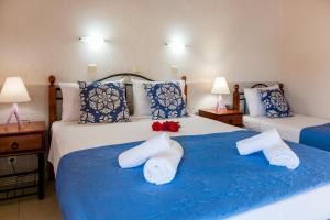 A bed or beds in a room at Hotel Electra