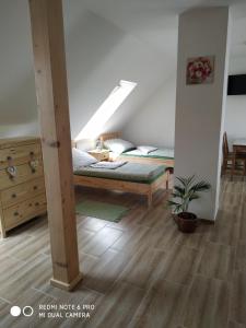 Postel nebo postele na pokoji v ubytování Ubytovani Ve stodole