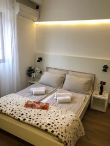 Postel nebo postele na pokoji v ubytování SPA Hotel Grand Krupanj