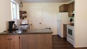a kitchen with a sink and a counter top at Eagle Cap Chalets in Joseph
