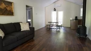 a living room with a couch and a table at Eagle Cap Chalets in Joseph