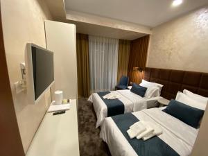 Μια τηλεόραση ή/και κέντρο ψυχαγωγίας στο Quartz Boutique Hotel