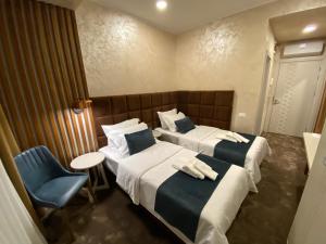 Ένα ή περισσότερα κρεβάτια σε δωμάτιο στο Quartz Boutique Hotel