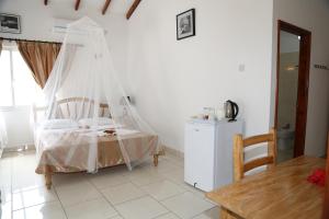 Postel nebo postele na pokoji v ubytování Villa Veuve Casadani Hotel