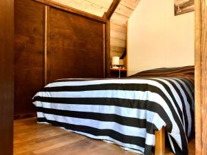 Postel nebo postele na pokoji v ubytování chalet de venosc