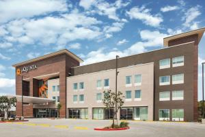 a rendering of the front of a hotel at La Quinta by Wyndham McAllen La Plaza Mall in McAllen