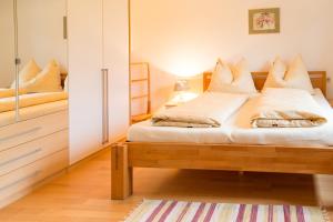 Postel nebo postele na pokoji v ubytování Strauss Appartements