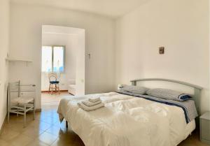 En eller flere senge i et værelse på Casa Siciliano