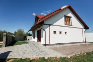 a small house with a red roof at Cottage Exclusive & dom4 in Grodno