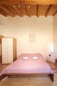 Posteľ alebo postele v izbe v ubytovaní Small stone house Luka