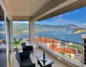 a balcony with a view of the ocean at Apartments Violeta in Budva