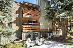 a house with two chairs in front of it at Sagewood 8 in Aspen